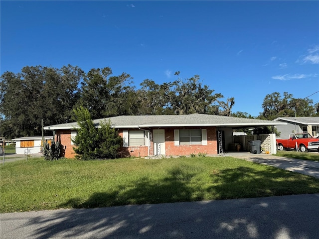 ranch-style home with a carport