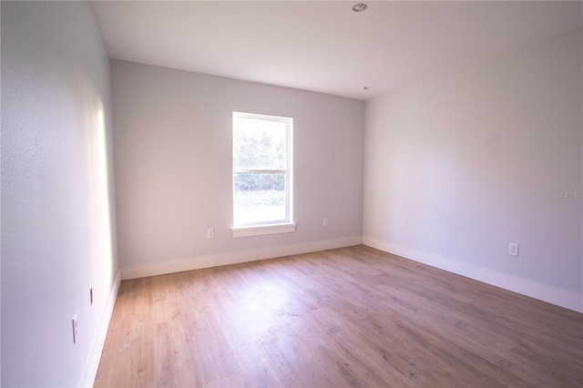 spare room with light wood-type flooring