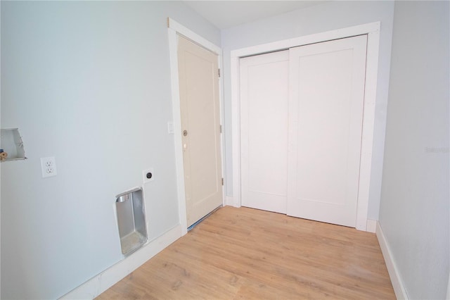 corridor featuring light hardwood / wood-style floors