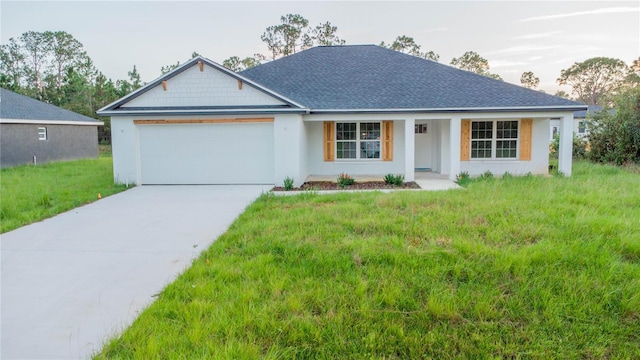 view of front of property with a porch, a garage, and a front yard