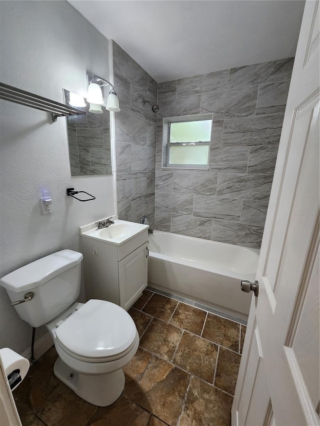 full bathroom with vanity, toilet, and tiled shower / bath