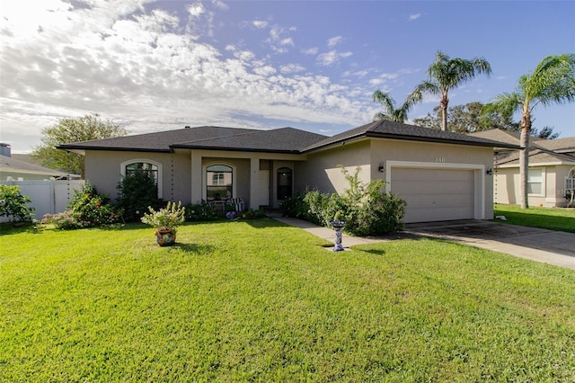 ranch-style home with a front yard and a garage