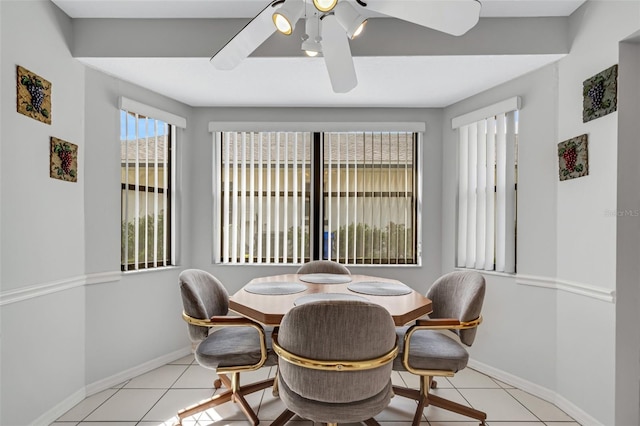 tiled dining area featuring ceiling fan