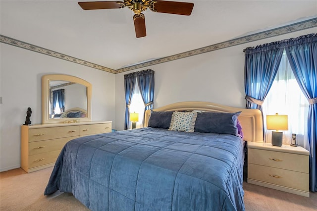 bedroom featuring ceiling fan and light colored carpet