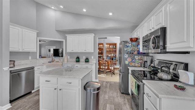 kitchen featuring white cabinetry, light hardwood / wood-style floors, and appliances with stainless steel finishes