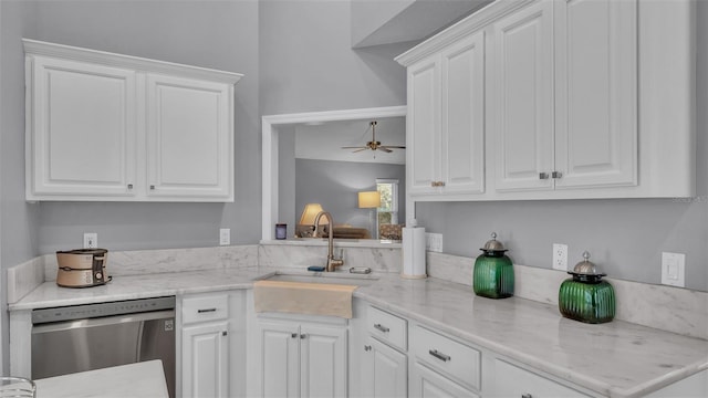 kitchen with ceiling fan, dishwasher, white cabinets, and sink