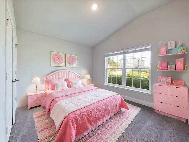 bedroom featuring dark colored carpet and vaulted ceiling