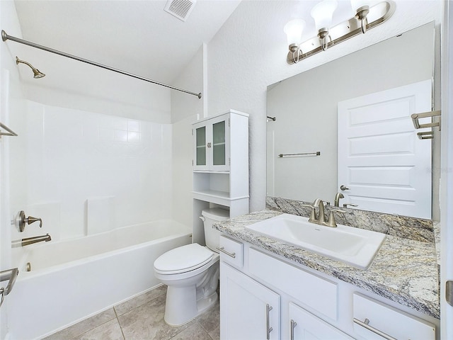 full bathroom featuring tile patterned floors, vanity, toilet, and washtub / shower combination