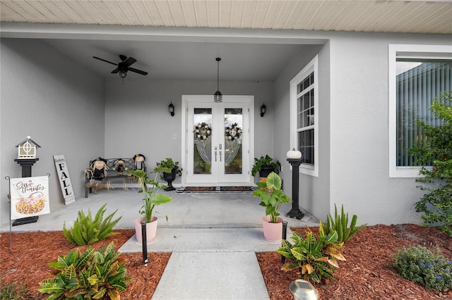 entrance to property with ceiling fan and french doors