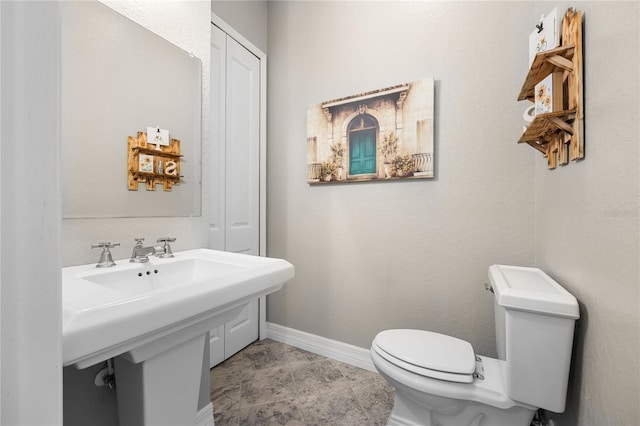 bathroom featuring tile patterned floors and toilet