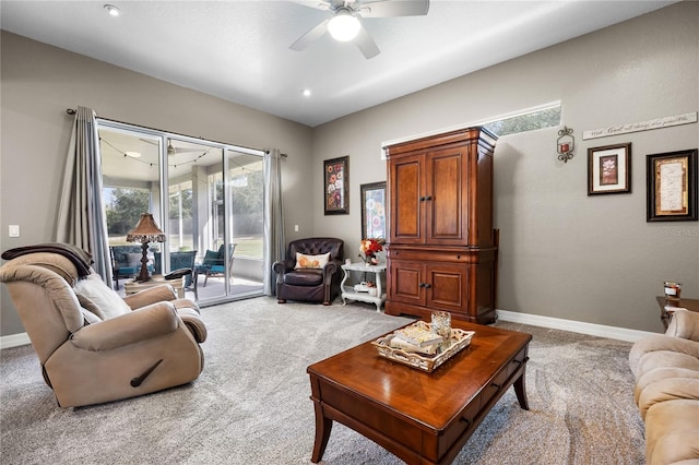 carpeted living room featuring ceiling fan