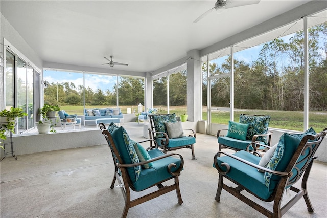 sunroom / solarium with ceiling fan