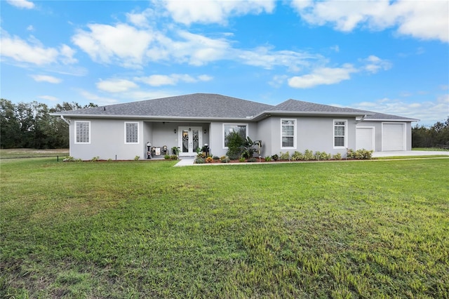 single story home featuring a front yard and a garage