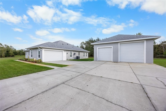 view of front of property with a front lawn and a garage