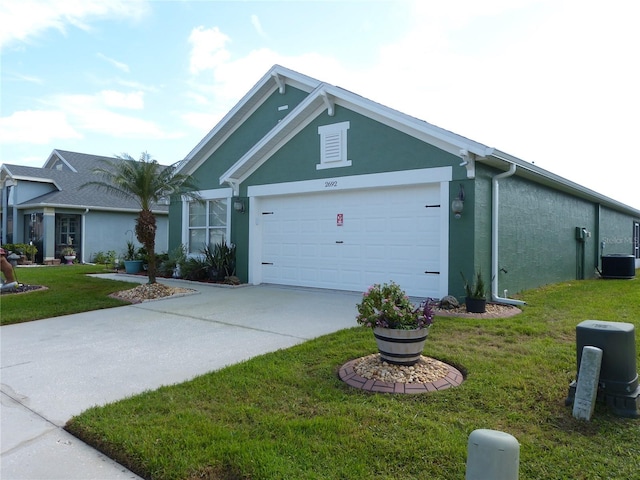 view of front of home featuring a front yard, a garage, and central AC unit