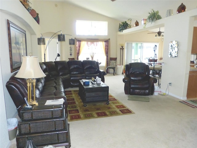 living room featuring carpet, vaulted ceiling, a wealth of natural light, and ceiling fan