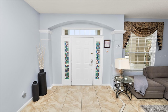 tiled entrance foyer with decorative columns