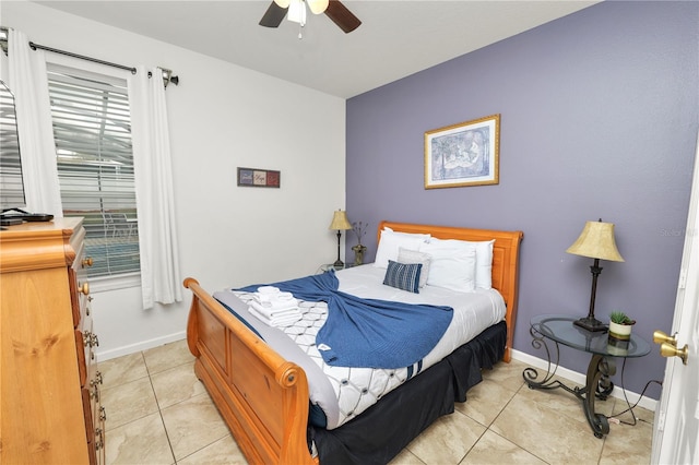 tiled bedroom with ceiling fan