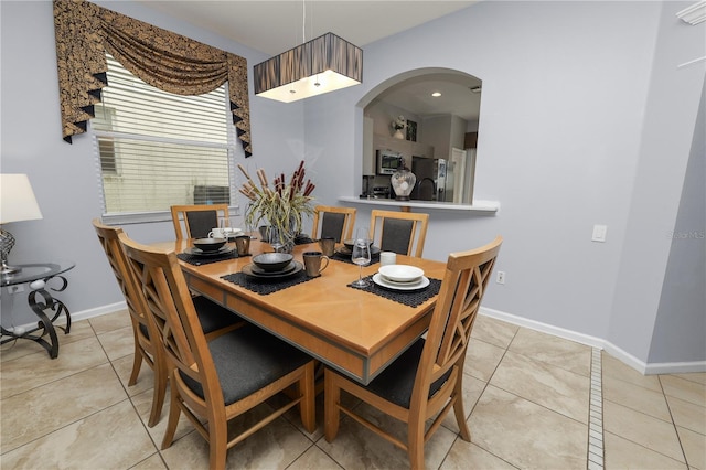 dining area featuring light tile patterned flooring