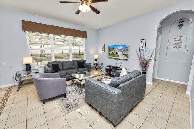 tiled living room featuring ceiling fan