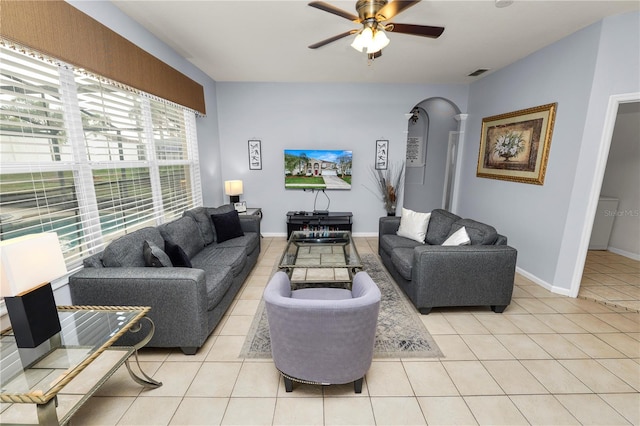 tiled living room with ceiling fan