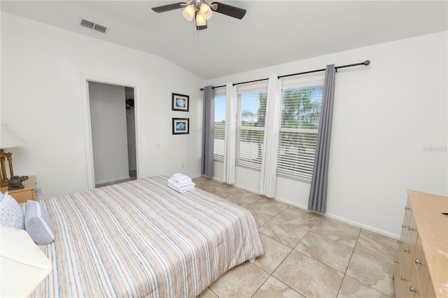 bedroom featuring light tile patterned floors, access to outside, vaulted ceiling, and ceiling fan