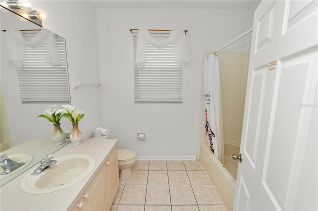 full bathroom featuring tile patterned floors, shower / bath combination with curtain, toilet, and vanity