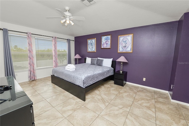 tiled bedroom with ceiling fan