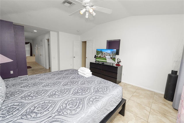 bedroom featuring vaulted ceiling, ceiling fan, and light tile patterned flooring