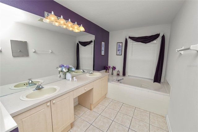 bathroom with tile patterned floors, a relaxing tiled tub, and vanity