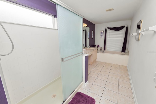 bathroom with tile patterned floors, vanity, and plus walk in shower