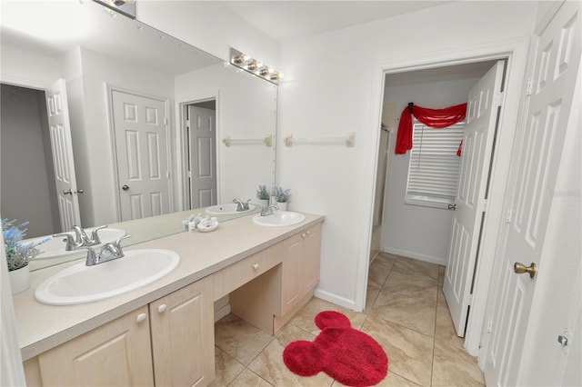 bathroom with tile patterned floors, vanity, and shower / bath combination with glass door