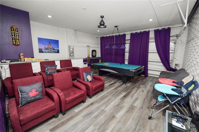 home theater with hardwood / wood-style floors and pool table