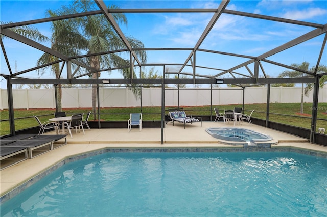 view of swimming pool featuring an in ground hot tub, a yard, a patio, and a lanai