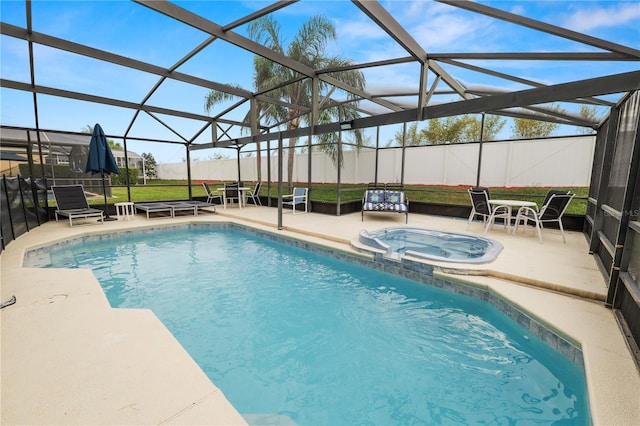 view of pool with an in ground hot tub, a patio, and a lanai