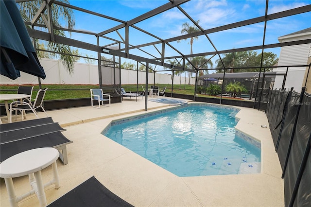 view of swimming pool with a lanai and a patio area