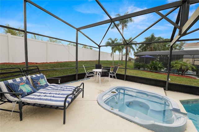 view of swimming pool with a patio, glass enclosure, a hot tub, and a lawn