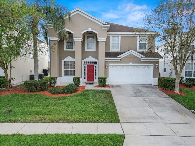 view of front of property featuring a garage and a front lawn