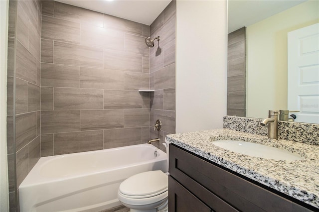 full bathroom featuring bathing tub / shower combination, vanity, and toilet