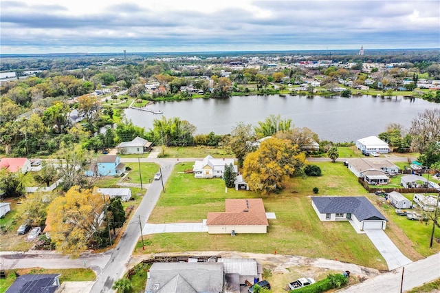 bird's eye view featuring a water view and a residential view