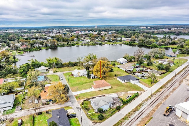 bird's eye view with a water view and a residential view