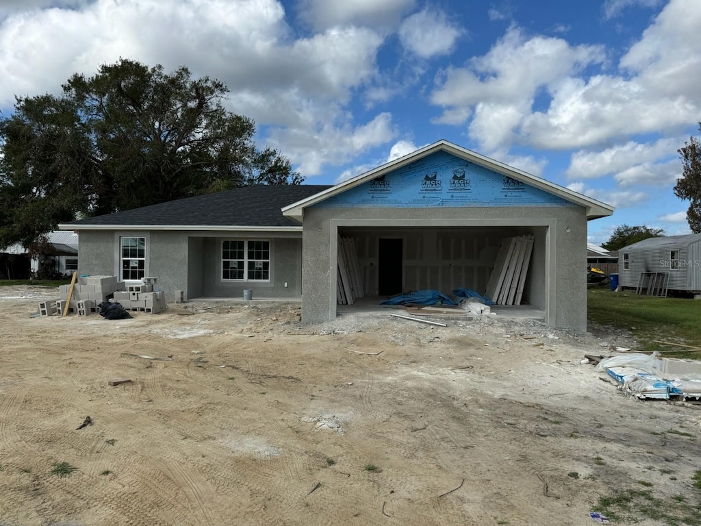 view of front of property with a garage