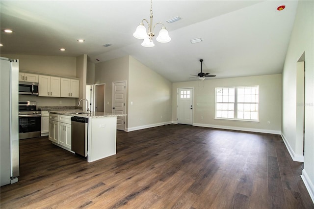 kitchen featuring baseboards, white cabinets, appliances with stainless steel finishes, dark wood-style flooring, and a sink