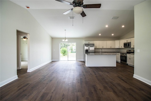 kitchen featuring visible vents, an island with sink, appliances with stainless steel finishes, white cabinetry, and a sink