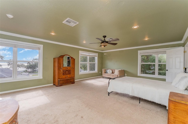 unfurnished bedroom featuring light colored carpet, multiple windows, and ceiling fan