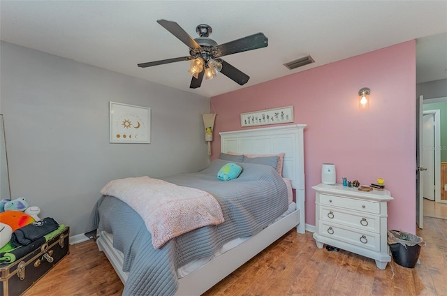 bedroom featuring ceiling fan and wood-type flooring