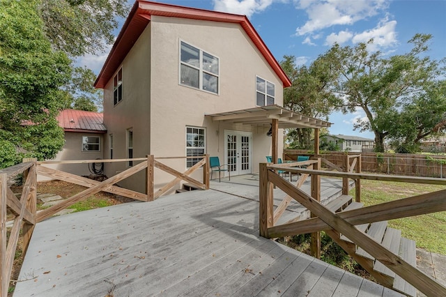 deck featuring french doors and a pergola