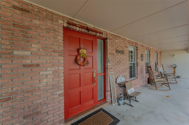 property entrance featuring a porch