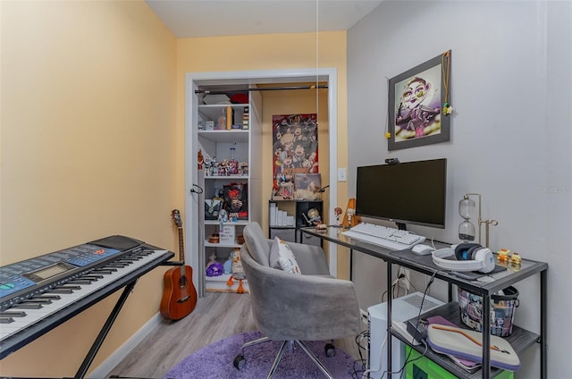 office area with light hardwood / wood-style floors