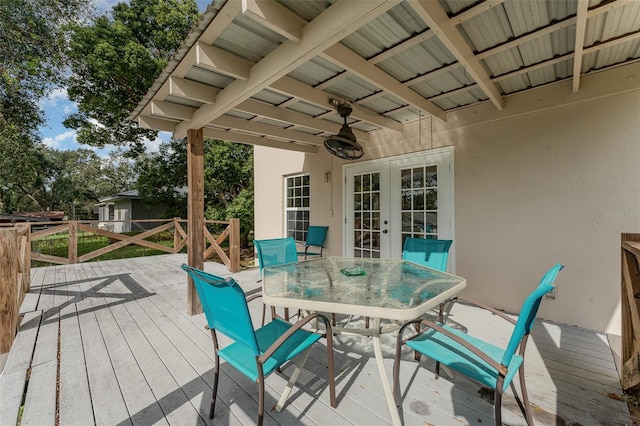 deck featuring ceiling fan and french doors